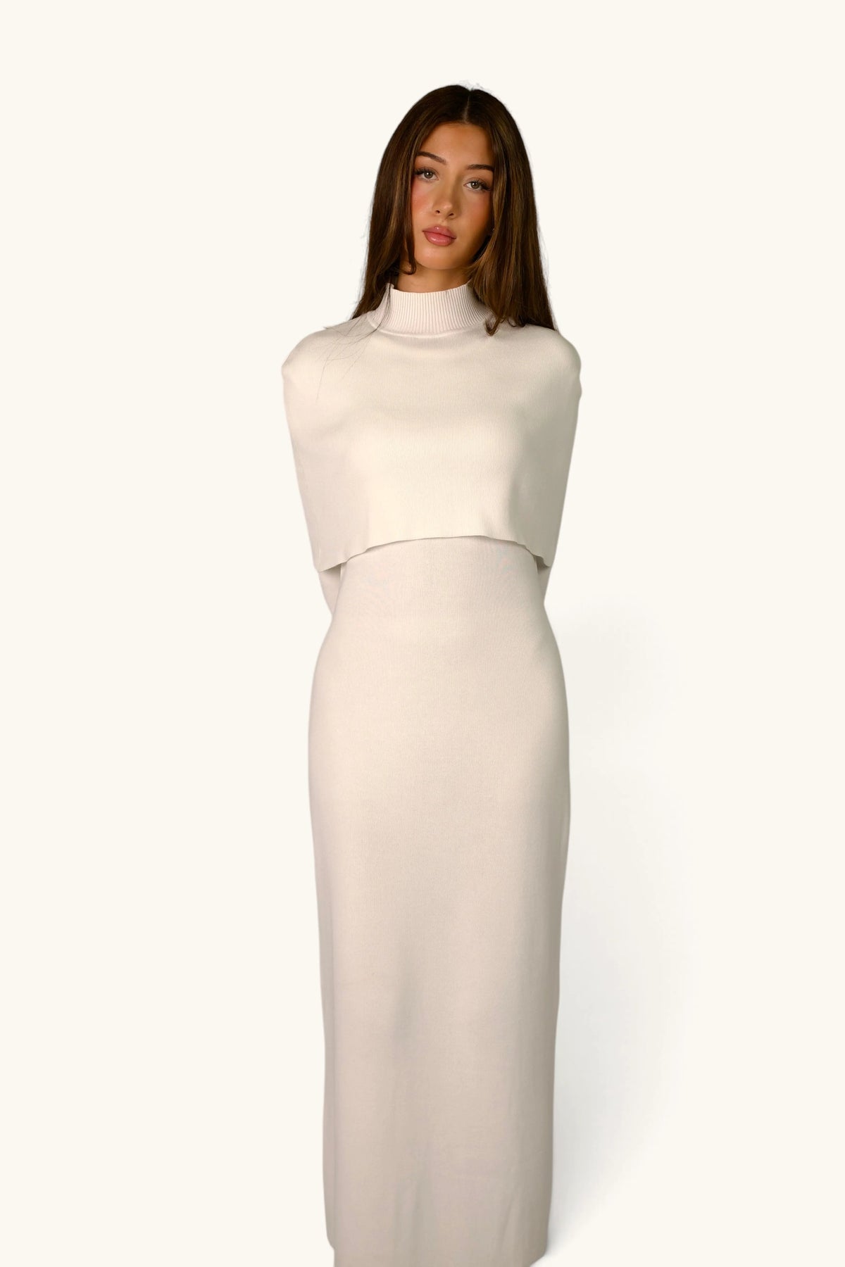 Gebreide jurk met cape-detail